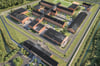 Diese Computergrafik zeigt, wie das künftige Gefängnis im Dreieck Wolbeck-Telgte-Alverskirchen einmal aus der Luft aussehen soll. Noch in dieser Woche soll die Grundsteinlegung stattfinden.