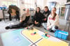 Anouk Meierhenrich, Zeynep Demirhan, Nico Völker und Skadi Krämer (v. l.) vom Roboterprofilkurs des Städtischen Gymnasiums präsentierten ihren selbstentwickelten LEGO-Mindstorm-Roboter.