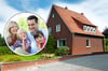 Cozy german red house. Home exterior. Einfamilienhaus+Familie