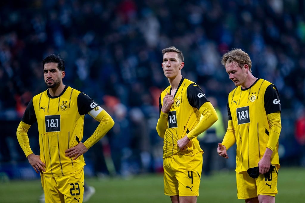 Ratlos nach dem erneuten Rückschlag: Emre Can, Nico Schlotterbeck und Julian Brandt (v.l.).